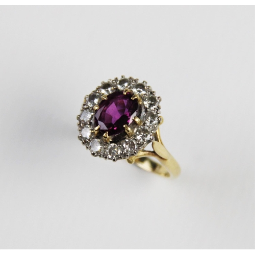 289 - A pink stone and diamond cluster ring, comprising a central untested oval mixed cut stone (probably ... 