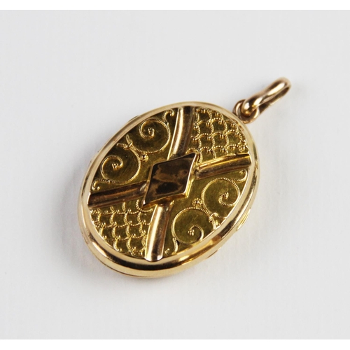 291 - A Victorian yellow metal locket pendant, of oval form, each side with applied rope twist scrolling d... 