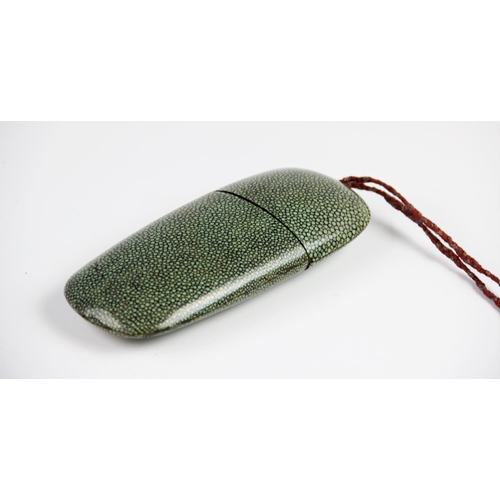 297 - A shagreen two piece spectacles case, 19th century, of typical form with plaited fabric closing tass... 