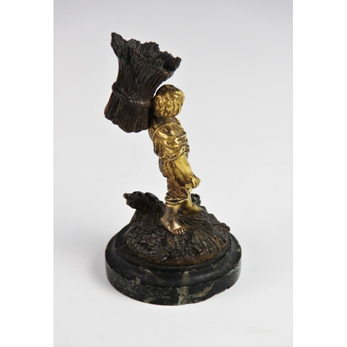 299 - A Grand Tour gilt bronze table vesta, 19th century, modelled as a young boy carrying a wheat sheaf, ... 