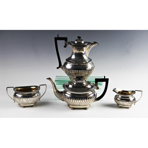 3 - An Edwardian four piece silver tea service by Joseph Gloster Ltd, Birmingham 1907/08, comprising tea... 