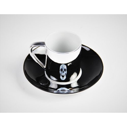 307 - After Damien Hirst (b.1965), a 'For The Love Of God...' electro-plated porcelain anamorphic cup and ... 