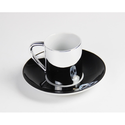 307 - After Damien Hirst (b.1965), a 'For The Love Of God...' electro-plated porcelain anamorphic cup and ... 