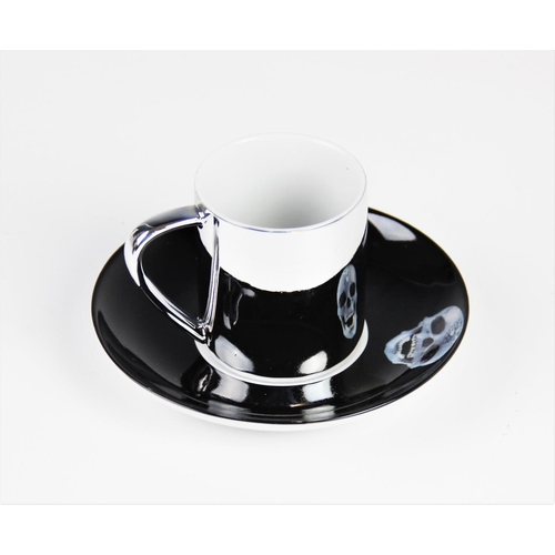 307 - After Damien Hirst (b.1965), a 'For The Love Of God...' electro-plated porcelain anamorphic cup and ... 