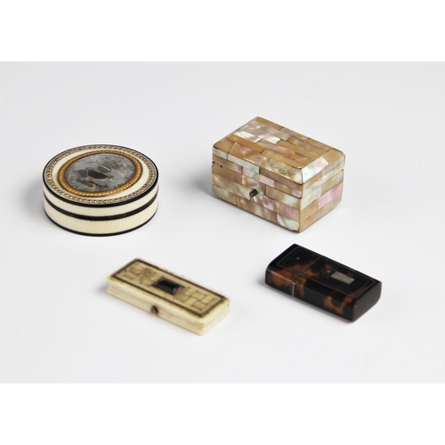 310 - An 18th century ivory snuff box, of circular form with tortoiseshell lined interior, glazed compartm... 