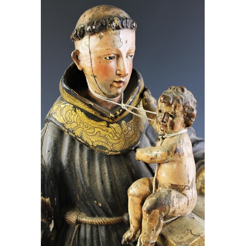 328 - An Italian carved painted wood and gesso figural carving of St. Anthony of Padua and Infant Christ, ... 