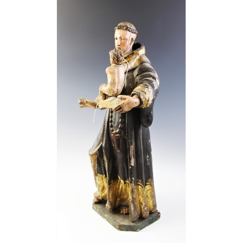 328 - An Italian carved painted wood and gesso figural carving of St. Anthony of Padua and Infant Christ, ... 