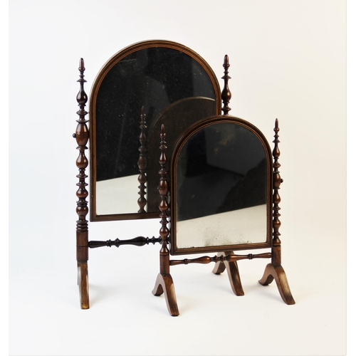 338 - A graduated pair of 19th century Puginesque dressing table mirrors, the turned walnut supports termi... 