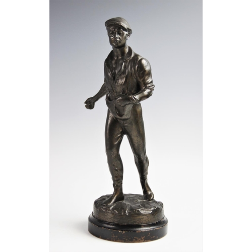 347 - Two cast spelter figures, 20th century, one modelled as a man sowing seed, the other as a woman bind... 