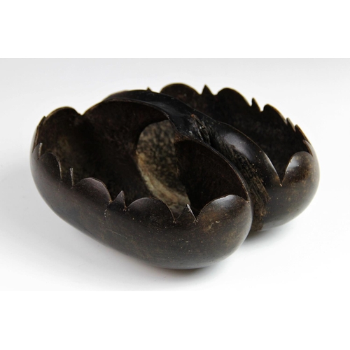 350 - A Coco-de-mer seed (Lodoicea maldivica), carved as a basket with shaped rim and integral handle fash... 