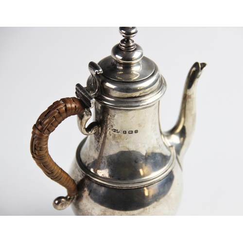 43 - A George V silver coffee pot by Wilson & Sharp, Birmingham 1912, of baluster form on domed circular ... 