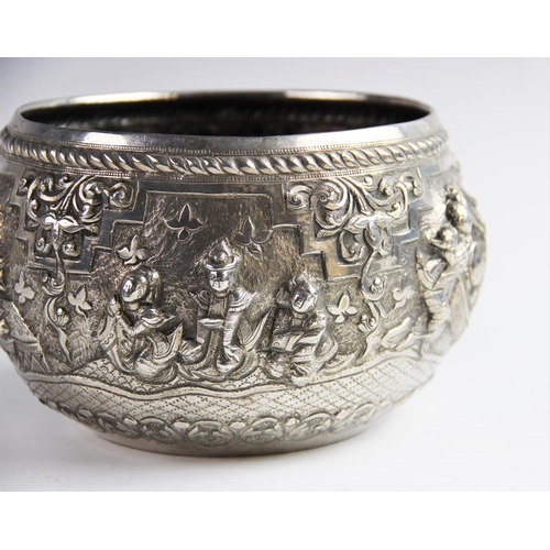 6 - A late 19th/early 20th century Burmese white metal bowl, of circular form decorated in high relief w... 