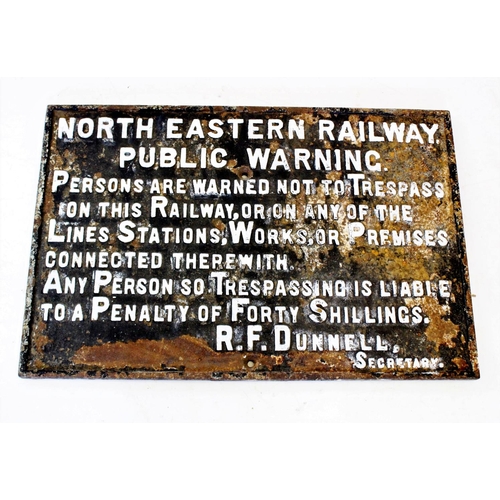 628 - An early 20th century cast iron railway sign, circa 1910, of rectangular form, with cast relief blac... 