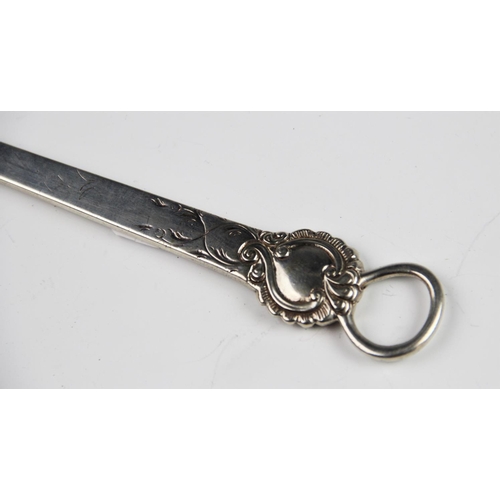 63 - A George III silver meat skewer, London 1775, of typical form with ring loop and scrolling foliate d... 