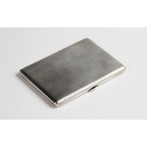 72 - An Art Deco silver cigarette case, of rectangular form with engine turned decoration to exterior, pu... 