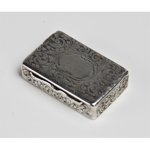 79 - A silver snuff box by Edward Smith, Birmingham 1851, of rectangular form engraved scrolling decorati... 