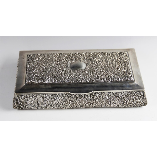 8 - An Edwardian silver mounted box by Henry Matthews, Birmingham 1903, of rectangular form with elabora... 