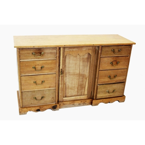 821 - A Victorian pine kitchen dresser base, the rectangular top with a later galleried back, above three ... 