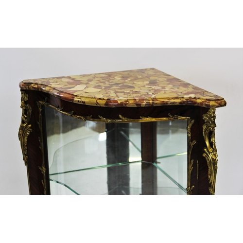 822 - A Louis XVI style marble top serpentine rosewood encoignure, 20th century, the rouge marble shaped t... 