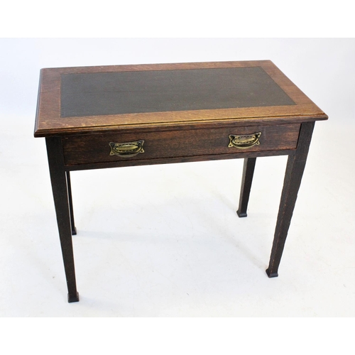 844 - An early 20th century Arts and Crafts oak writing table, the leather inset rectangular moulded top a... 