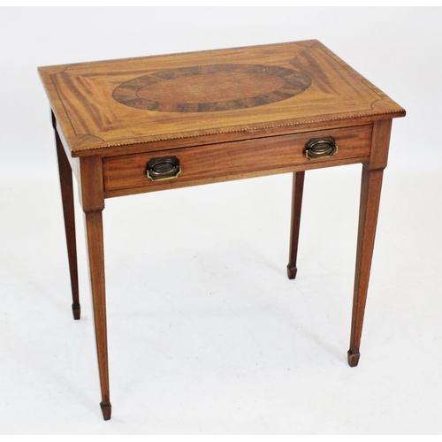 853 - An Edwardian mahogany occasional table, the rectangular top centred with an inlaid parquetry oval wi... 