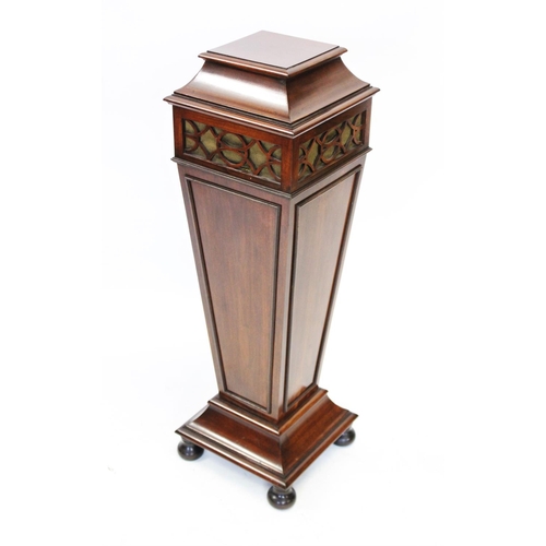 856 - An Edwardian mahogany lamp or urn pedestal, the pagoda shaped top above a fretwork frieze, and a tap... 