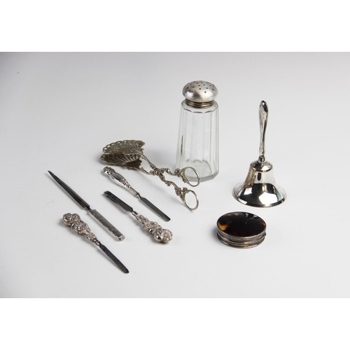 87 - A selection of silver tableware and accessories, to include a pair of continental silver serving ton... 