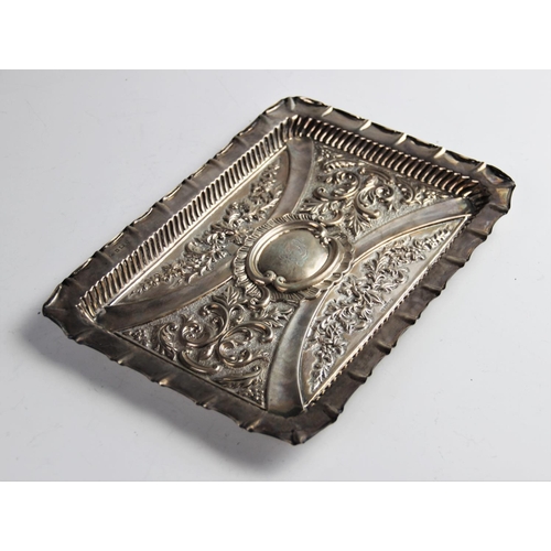 9 - A late Victorian silver tray by William Devenport, Birmingham 1900, of rectangular form with embosse... 