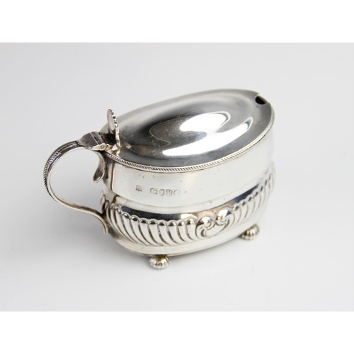 95 - A Victorian silver wet mustard by William Hutton & Sons, London 1887, of oval form with half reeded ... 