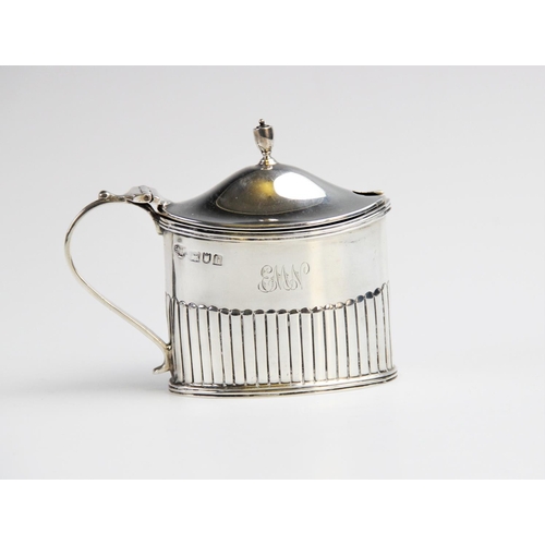 96 - An Edwardian silver wet mustard by Goldsmiths & Silversmiths Co, London 1903, of oval form with half... 