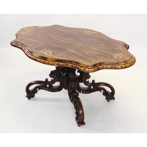 828 - A Victorian rosewood centre table, the shaped top inlaid with foliate sprigs united by stringing, an... 