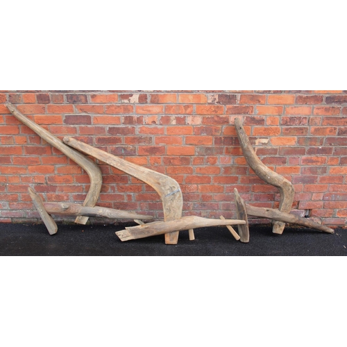 865 - Five rustic wooden oxen ploughs, of typical carved form, applied with an iron blade, approx length 1... 