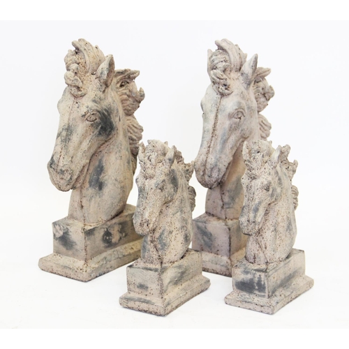 866 - Two pairs of composite stone horse busts, each modelled with a flowing mane and mounted upon a recta... 