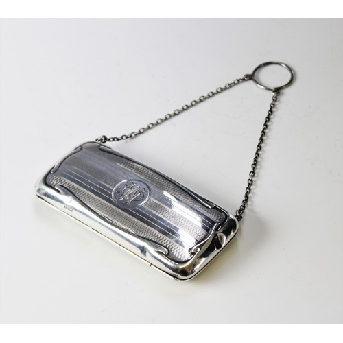 19 - A George V silver purse by Clark & Sewell Chester 1916, of rectangular form with engine turned decor... 