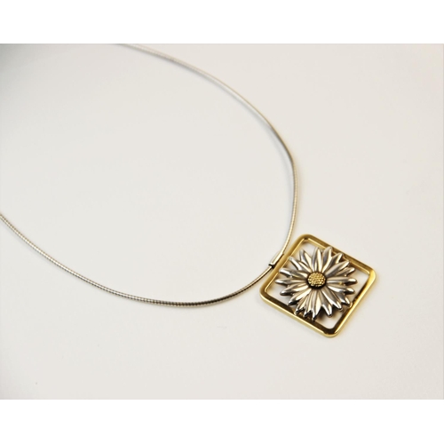 251 - A Tiffany 18ct gold and silver daisy pendant, designed as a two-colour moulded daisy set to a square... 