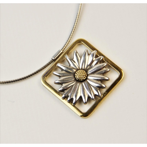 251 - A Tiffany 18ct gold and silver daisy pendant, designed as a two-colour moulded daisy set to a square... 