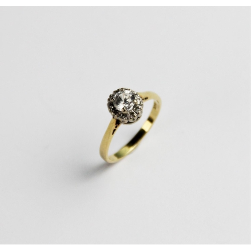 263 - A zircon and diamond 18ct gold cluster ring, comprising a central round brilliant cut white zircon m... 