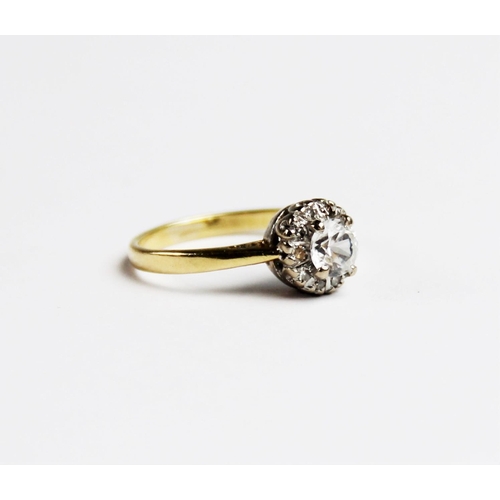 263 - A zircon and diamond 18ct gold cluster ring, comprising a central round brilliant cut white zircon m... 