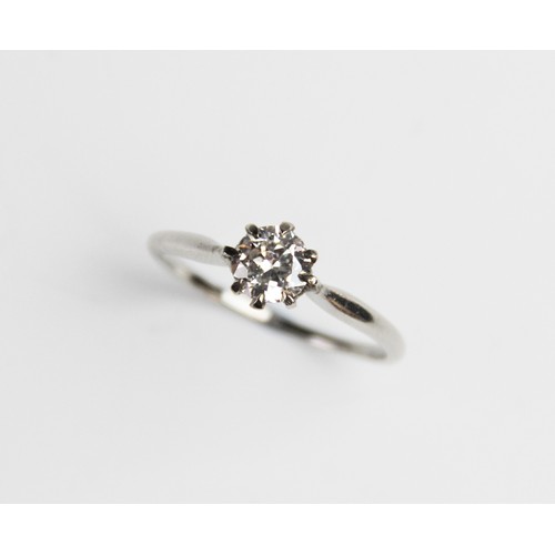 188 - A diamond solitaire ring, the central round brilliant cut diamond weighing approx. 0.73 carats, clar... 