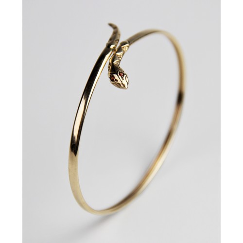 269 - A 9ct gold snake bangle, the plain polished oval bangle with stylised snake head and tail, with two ... 