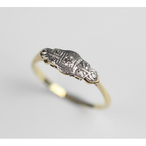 270 - An early 20th century diamond set ring, comprising a  central round brilliant cut diamond weighing a... 