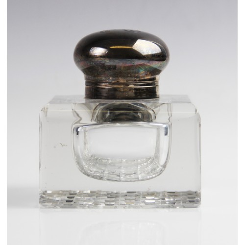 26 - A late Victorian silver mounted cut glass inkwell by George Bedingham, London 1899, of compressed cu... 