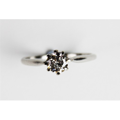 188 - A diamond solitaire ring, the central round brilliant cut diamond weighing approx. 0.73 carats, clar... 