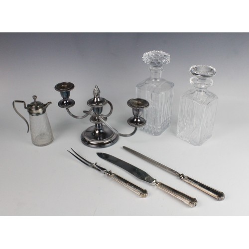 106 - A quantity of silver plated and white metal wares, to include a large twin-handled silver plated tra... 