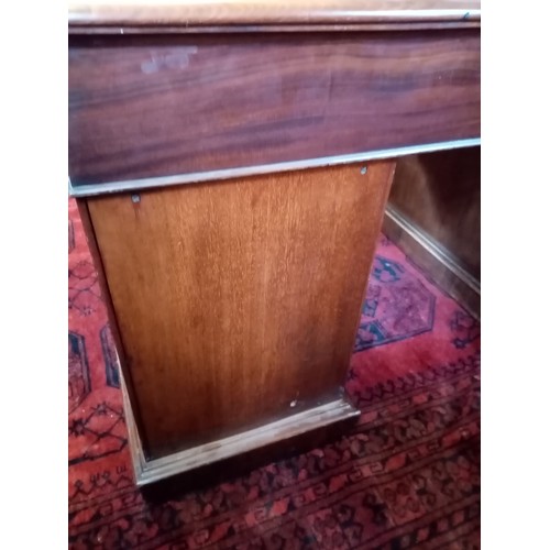 858 - An Edwardian mahogany and satinwood crossbanded twin pedestal desk, the rectangular moulded top with... 