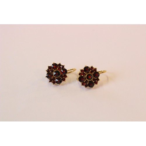 222 - A suite of Bohemian garnet set silver gilt jewellery, to include a pair of floral cluster drop earri... 