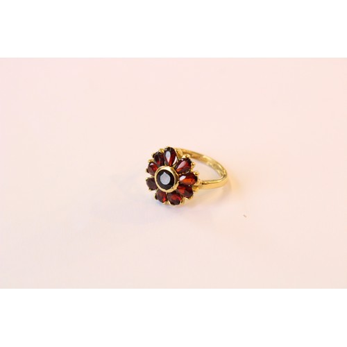 222 - A suite of Bohemian garnet set silver gilt jewellery, to include a pair of floral cluster drop earri... 