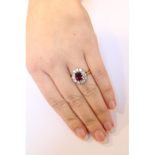 289 - A pink stone and diamond cluster ring, comprising a central untested oval mixed cut stone (probably ... 