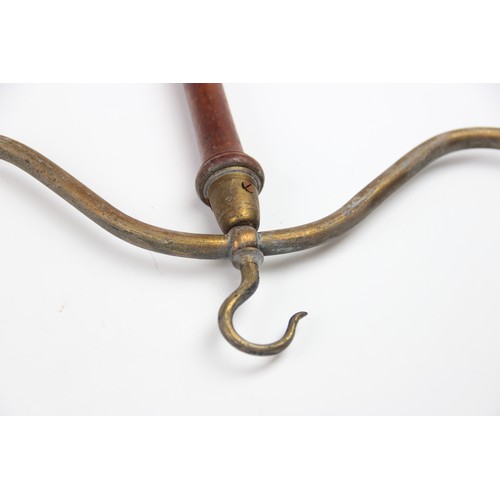 318 - Five Victorian wig and gown hangers, the lacquered brass hooks terminating two arms supported by a t... 