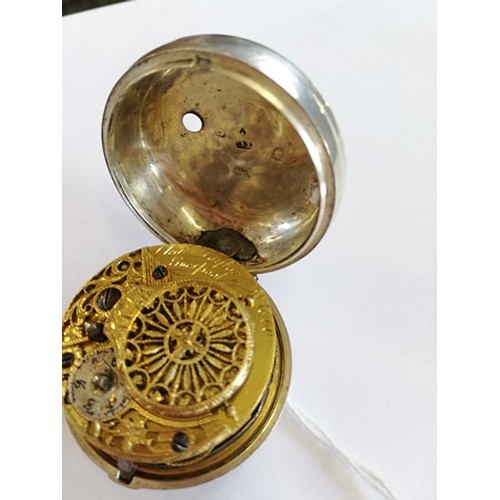 128 - A George IV silver pair case pocket watch the round white dial with Roman numeral markers, set to a ... 